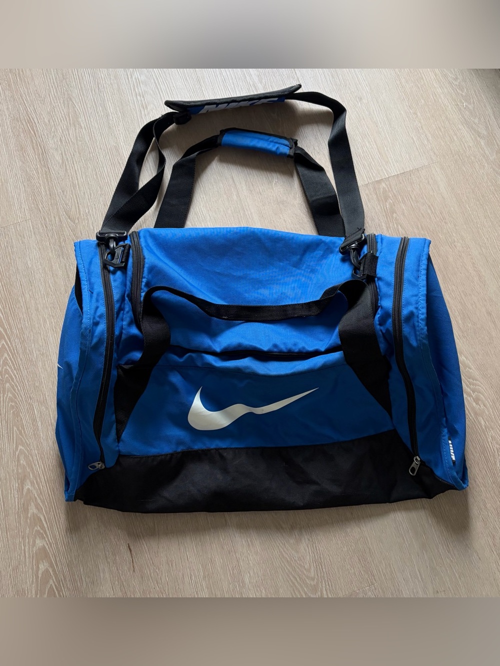 Nike Blue and Black Men's Athletic Duffel Bag with White Swoosh